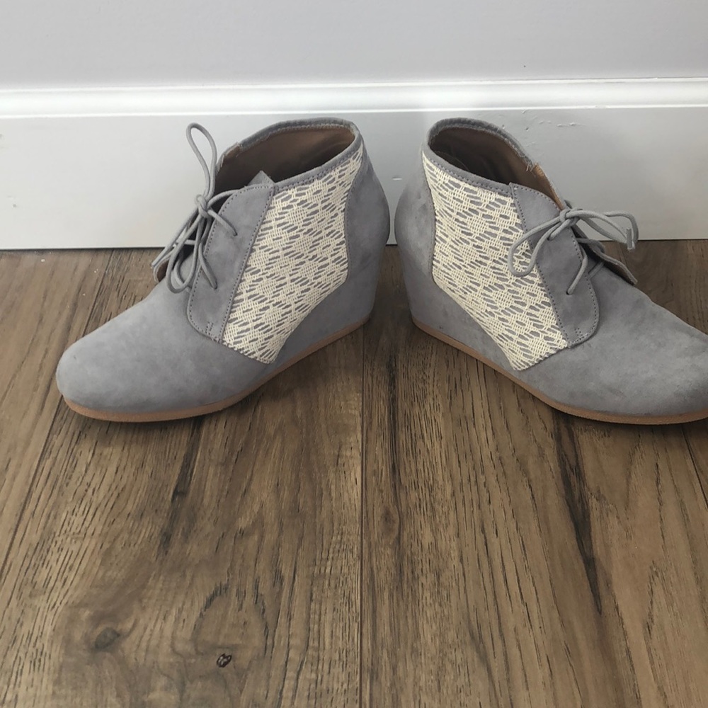Gray booties with lace detail.